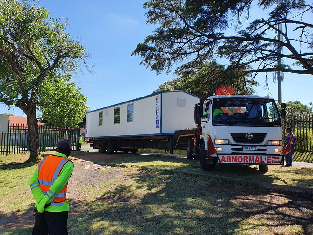 Container Conversions park home being delivered to site on flat bed truck